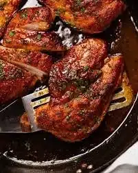 Delicious chicken breast dinner served with vegetables and herbs