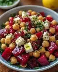 Chickpea Beet and Feta Salad served in a bowl with fresh ingredients