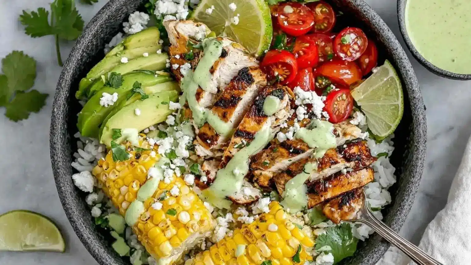 Cilantro lime chicken served in a delicious rice bowl with vibrant toppings