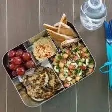 Selection of easy cold lunches for work, featuring salads, wraps, and snacks.