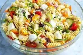 Delicious easy pasta salad with colorful vegetables and dressing