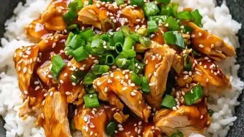 Delicious slow cooker chicken teriyaki served on a plate with vegetables.