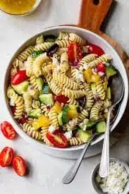Healthy pasta salad with vegetables in a bowl