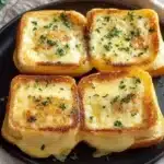 Platter of mini grilled cheese sandwiches with melted cheese