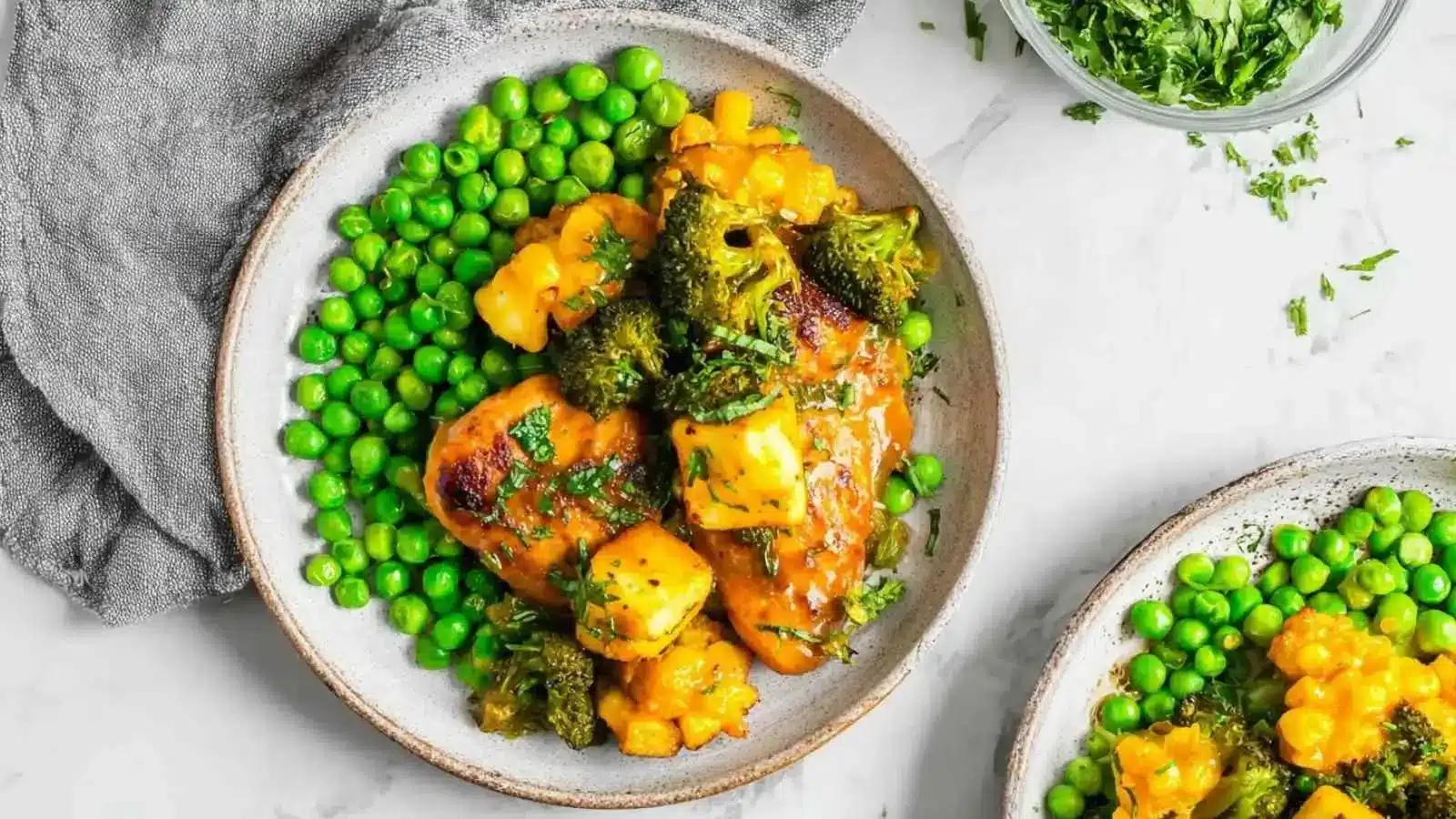 Delicious Peri-Peri Chicken served with Halloumi and Minty Chilli Peas on a plate