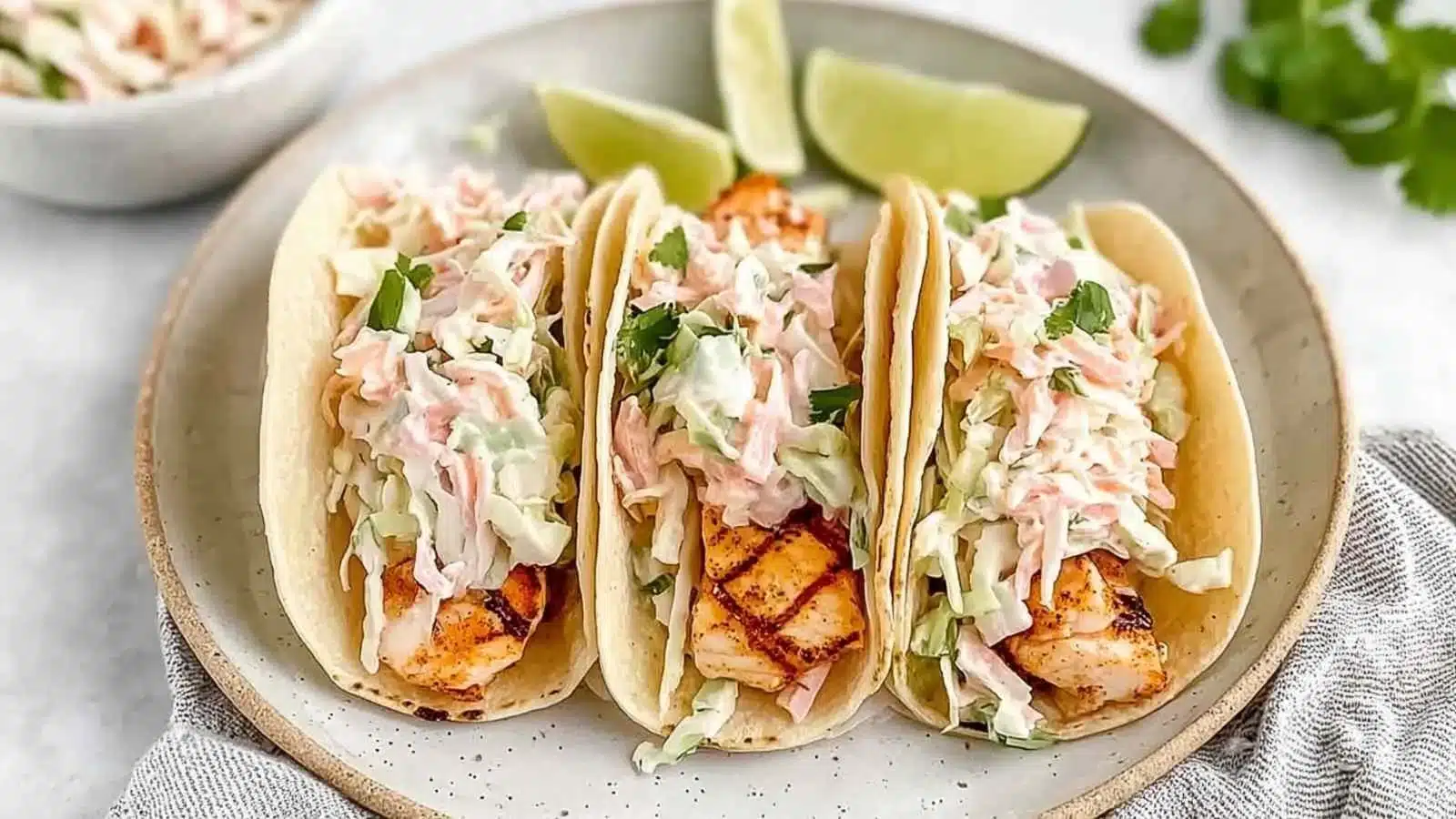 Delicious quick grilled fish tacos served with fresh cabbage slaw