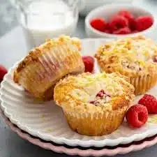 Freshly baked Raspberry Streusel Muffins on a plate