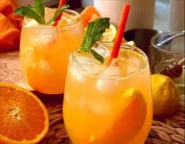 Refreshing 4-ingredient orange lemonade served in a glass with ice