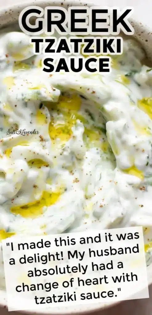 Bowl of creamy tzatziki sauce with fresh herbs and cucumber slices