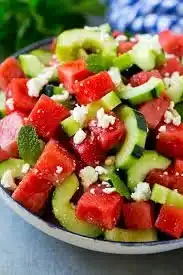 Fresh Cucumber Watermelon Salad in a bowl with mint garnish