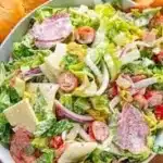 Delicious and colorful Grinder Salad with fresh vegetables and dressing