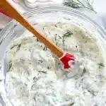 Healthy Greek tzatziki sauce made with yogurt, cucumbers, and herbs.