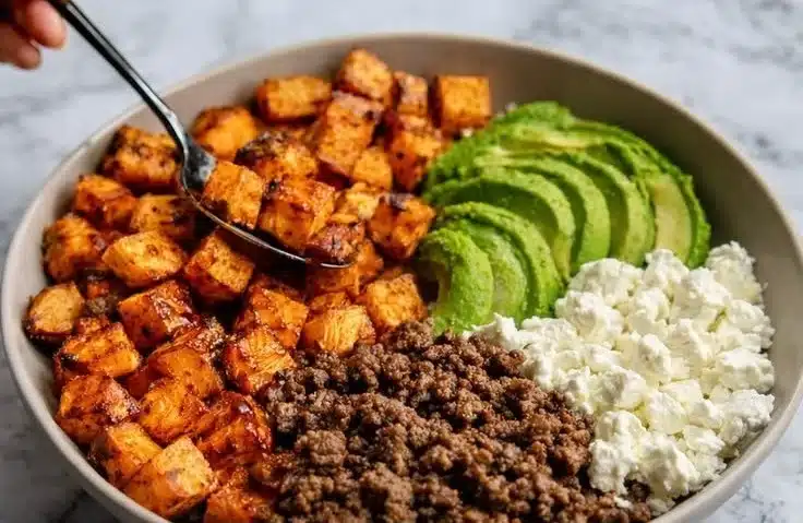 Hot Honey Sweet Potato Beef Bowls with vibrant colors and garnished vegetables.