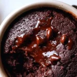 Delicious Microwave Greek Yogurt Mug Cake served in a mug with a spoon