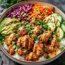 Savory Bang Bang Chicken Bowl with colorful ingredients and spices