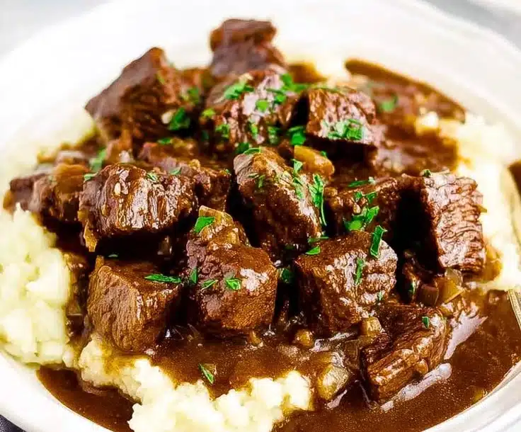 Delicious slow-cooked beef in savory gravy served with vegetables
