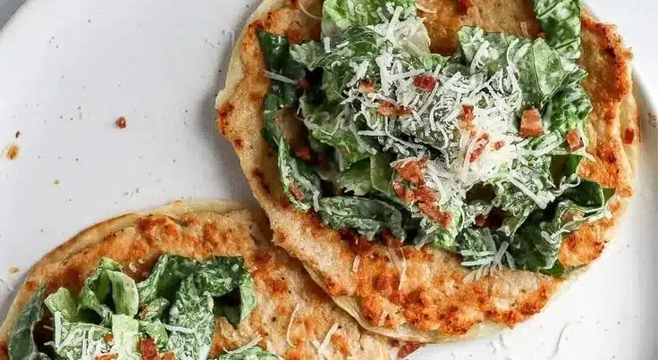 Smash Chicken Caesar Tacos topped with romaine and Caesar dressing