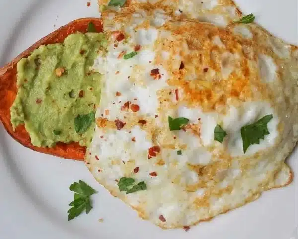 Delicious sweet potato toast topped with avocado and seeds