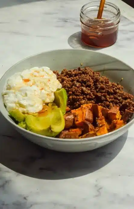 Viral hot honey ground beef bowl with colorful veggies and grains