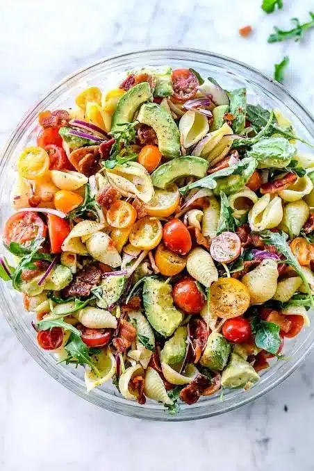 Bowl of fresh BLT Pasta Salad with bacon, lettuce, and tomatoes