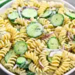 Creamy Cucumber Pasta Salad served in a bowl with fresh cucumbers and herbs
