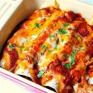 Delicious easy chicken enchiladas served with salsa and garnished with fresh cilantro.