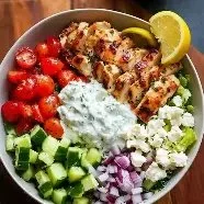 Delicious Greek Chicken Power Bowl with fresh vegetables and herbs