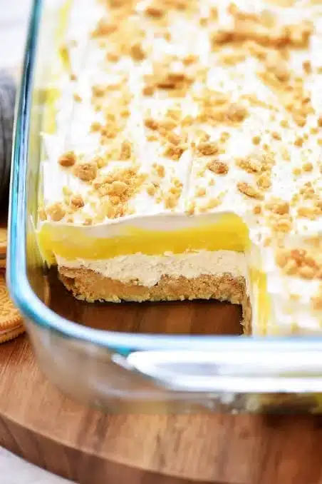 Heavenly Lemon Oreo Dessert Bars topped with lemon zest and crushed Oreos.