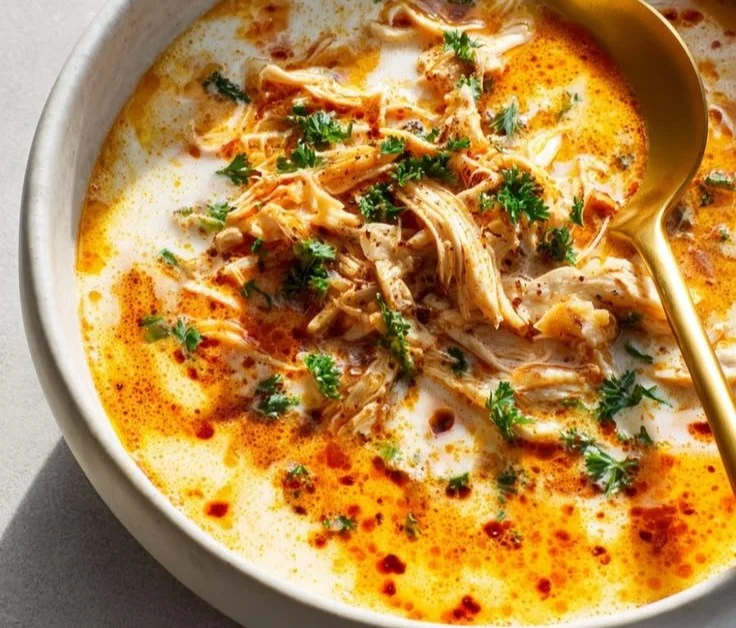 Bowl of high protein low carb chili topped with fresh herbs and spices