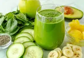High protein smoothie with fruits and protein powder in a glass.