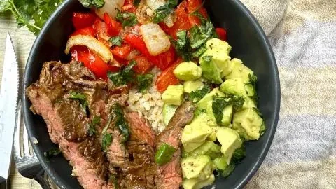 High protein steak fajita bowl with colorful vegetables and tender beef