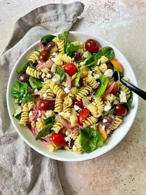 Colorful Mediterranean Pasta Salad with olives, tomatoes, and feta cheese