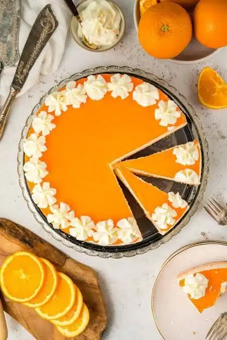 No-Bake Orange Creamsicle Cheesecake with orange slices and whipped cream
