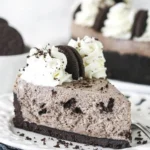 No Bake Oreo Cheesecake with crushed Oreos and creamy filling on a dessert plate