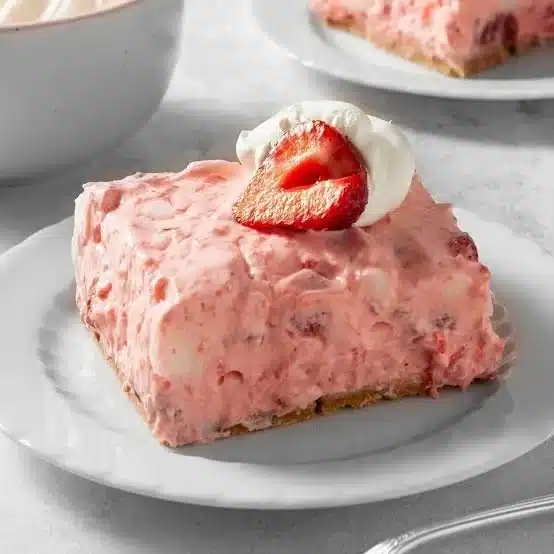 Delicious no-bake strawberry delight dessert served in a glass bowl