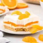 Orange Dreamsicle Lush dessert featuring creamy orange layers