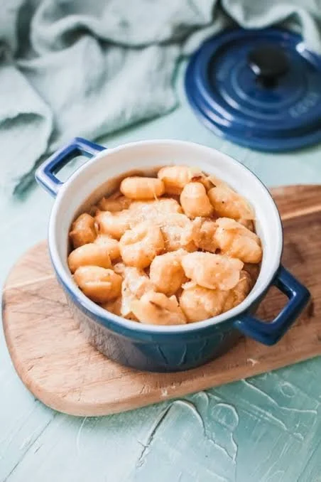 Savory French Onion Gnocchi Bake topped with golden caramelized onions and cheese
