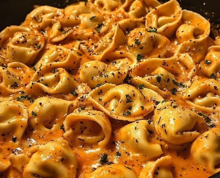 Creamy baked macaroni and cheese topped with breadcrumbs and fresh herbs