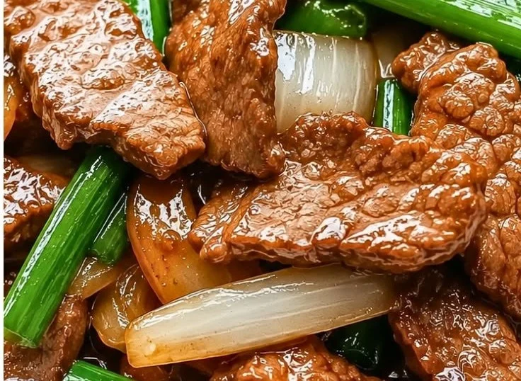 Easy Chinese Beef Onion Stir Fry on a plate with vegetables