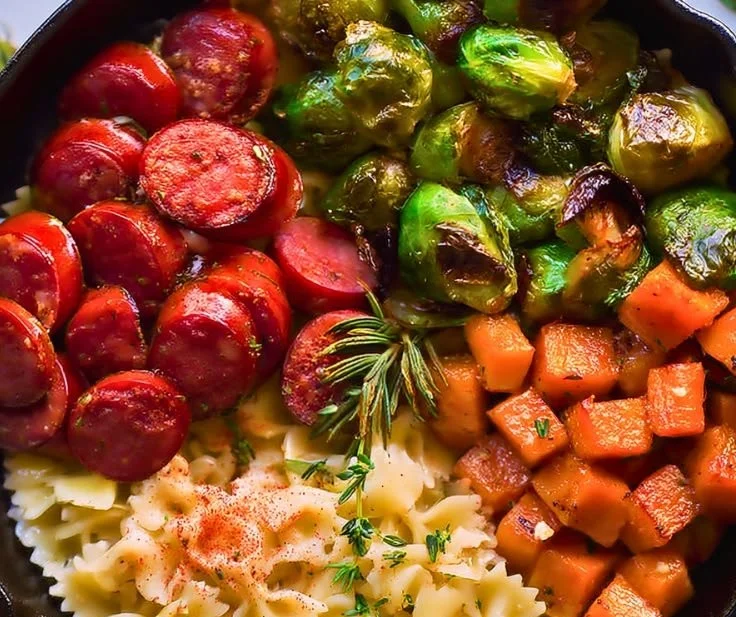 Delicious easy fall sausage pasta served in a bowl with herbs