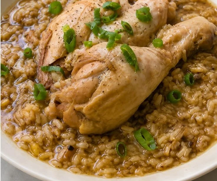 Bowl of easy scorched rice chicken soup with herbs and spices.