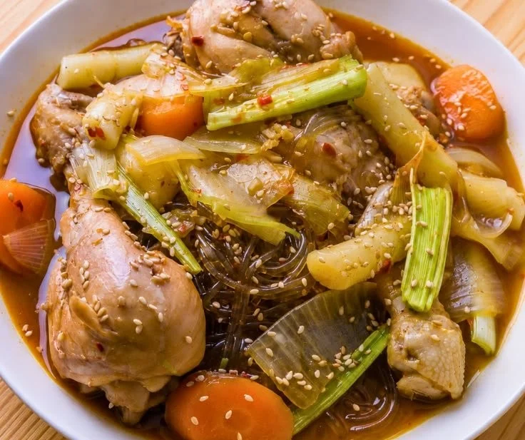 Bowl of easy spicy chicken stew with vegetables and herbs
