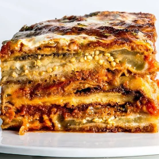 Delicious homemade Eggplant Parmesan with layers of eggplant, marinara, and cheese.