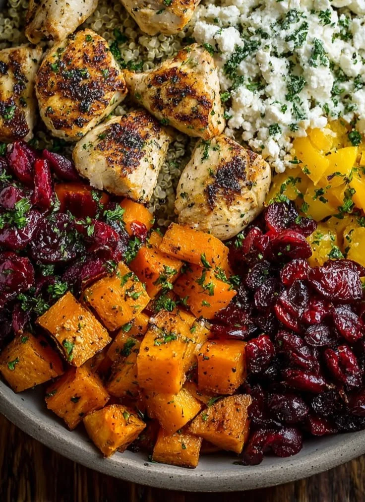 Delicious Greek Chicken Harvest Bowl with fresh vegetables and feta cheese
