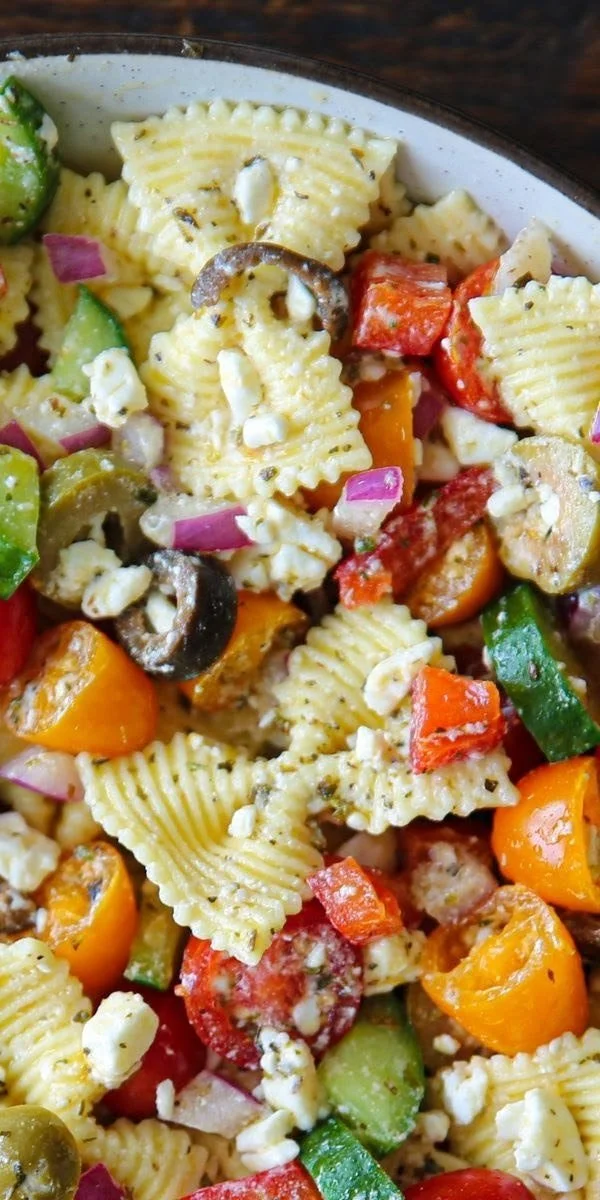 Delicious Greek Pasta Salad with olives, feta, and vegetables in a bowl.