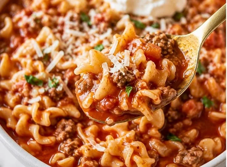Healthy high protein lasagna soup in a bowl garnished with herbs