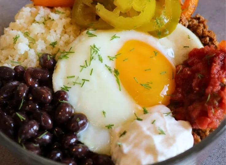 Healthy taco breakfast bowls topped with fresh ingredients and vibrant flavors