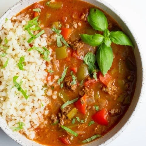 Bowl of high protein stuffed pepper soup with colorful peppers and herbs
