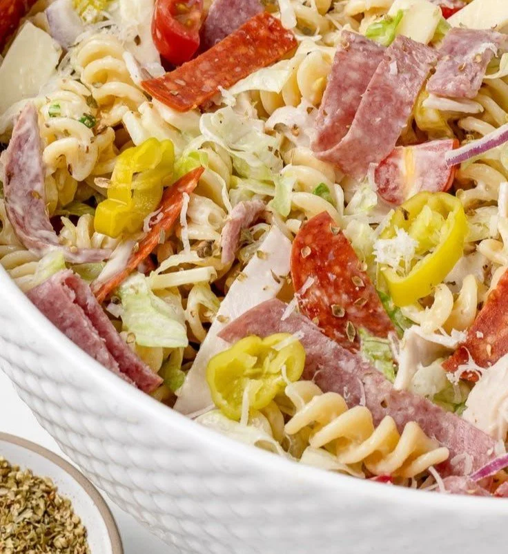 Colorful Italian Grinder Pasta Salad with fresh vegetables and dressing