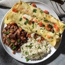 Delicious Chicken Enchiladas from Joanna Gaines' recipe, served on a plate